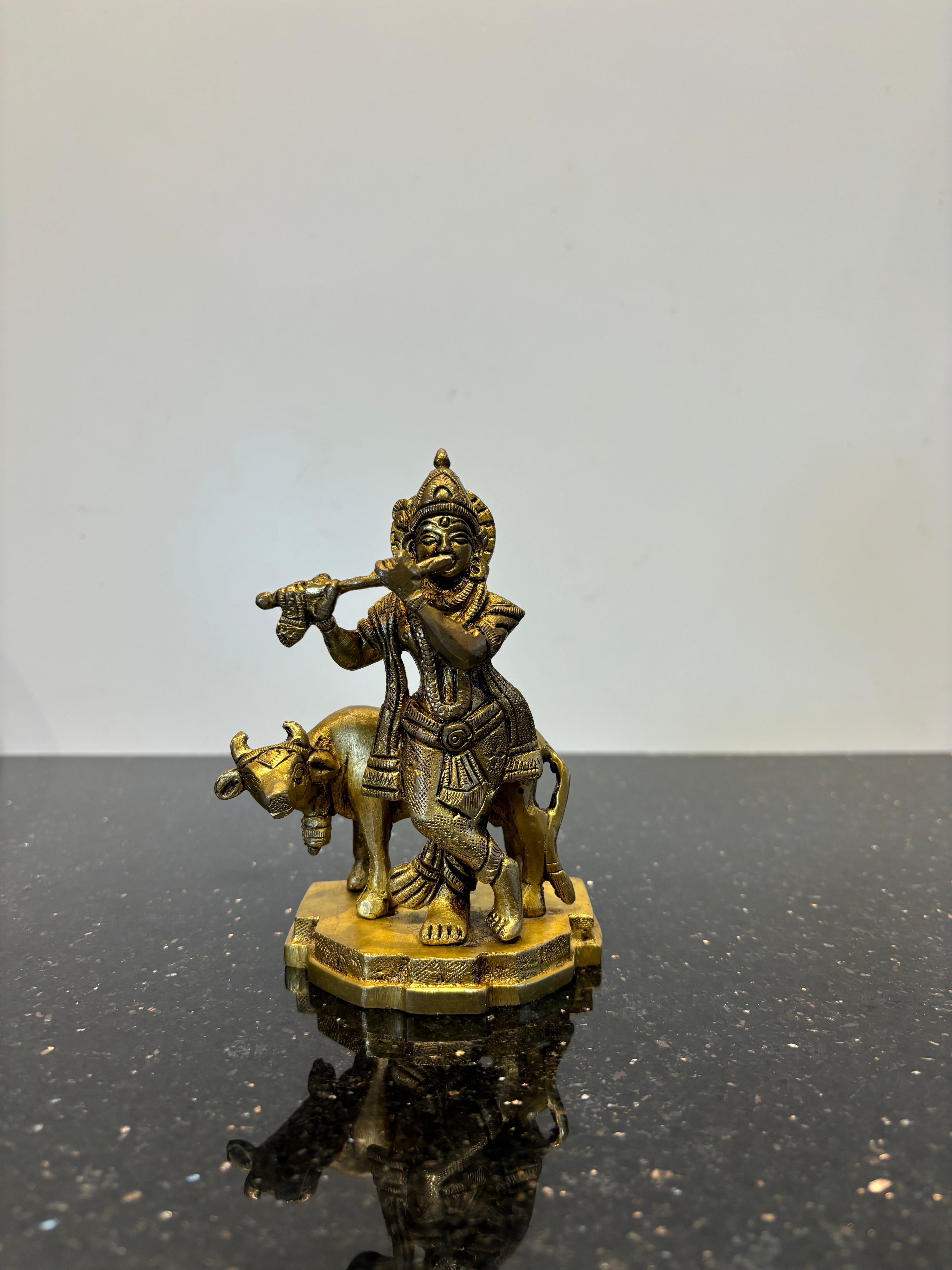 Krishna with flute cow